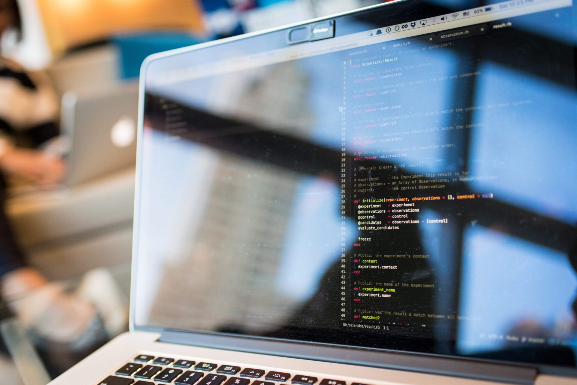 a macbook that has a coding tool open